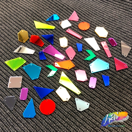 Colorful loose cut mirrors in different shapes and sizes.
